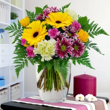 Variety of colours and hues, stunning arrangement of flowers and greenery. With this cheerful bouquet make the day of your loved ones special, smiling and happy.