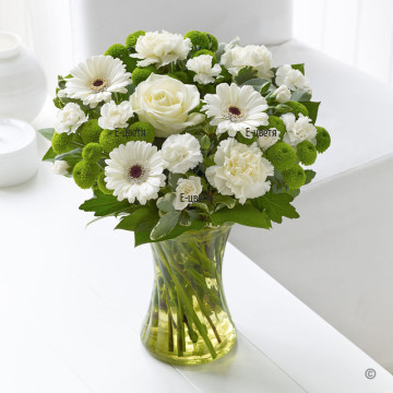 Lovely, delicate bouquet of various flowers, in white and green colours, perfectly arranged by our local florists.