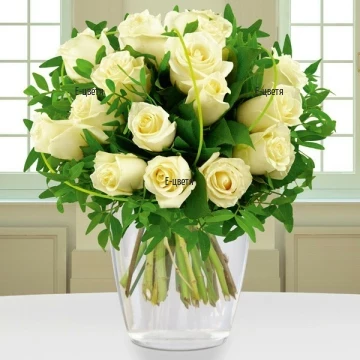 Gentle caress, fascinating embrace, silence and peace. Beautiful and unique bouquet of white roses and fresh greenery.