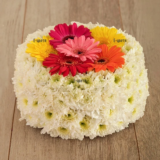 Online order and delivery of cake of flowers and greenery.