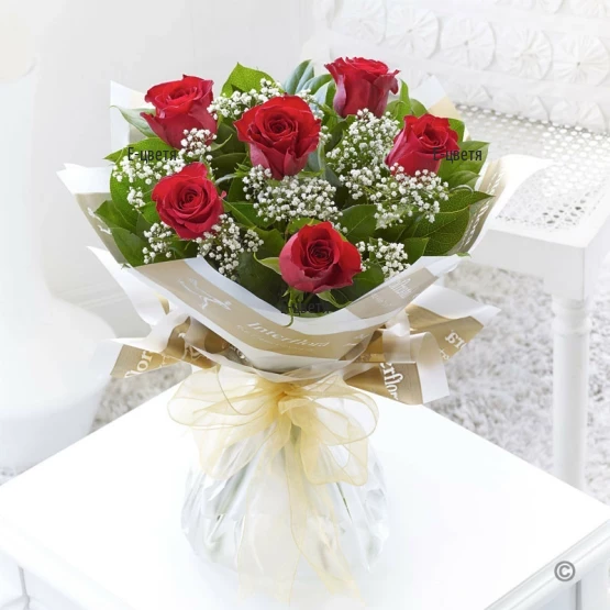 Online order and flower delivery  by courier - a bouquet of roses.
