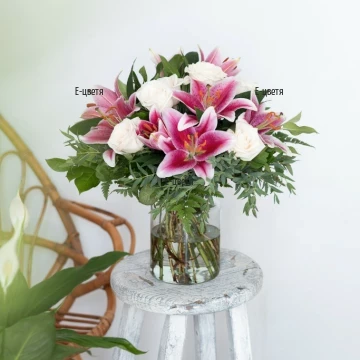 Luxuriant bouquet of pink lilies and white roses.