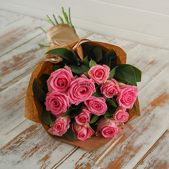 Send a bouquet of pink roses and gift paper.