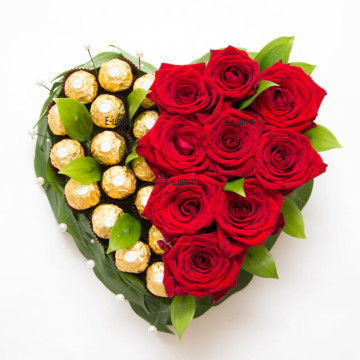 Romantic arrangement in the shape of heart - red roses and  Ferrero Rocher chocolates.