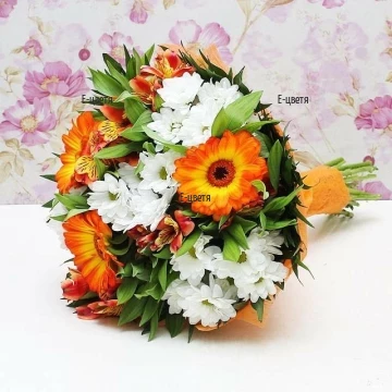 Classic arrangement of mixed flowers, perfect for late Summer or early Fall. Bright bouquet of mixed flowers in yellow-orange hues, perfectly accented by loving white chrysanthemums and greenery.