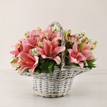 Send a basket with lilies and greenery.