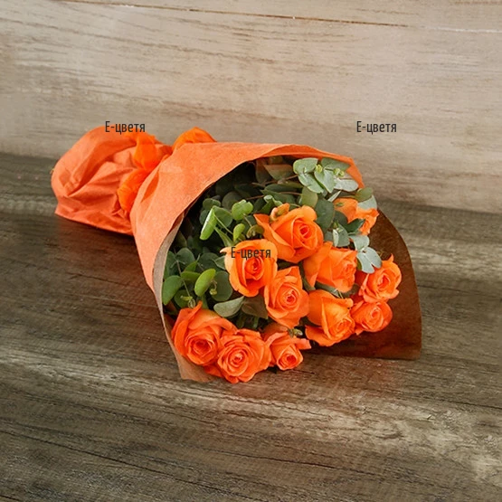 Send bouquet of orange roses and greenery