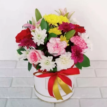 A modern arrangement of flowers in a box, carrying a positive, lively charge and a feeling of freshness and awakening.