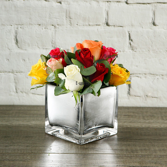 An online order - send an arrangement with roses in glass cube