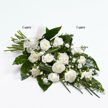 Beautiful, tender bouquet - combination of white roses, white chrysanthemums and lush foliage.