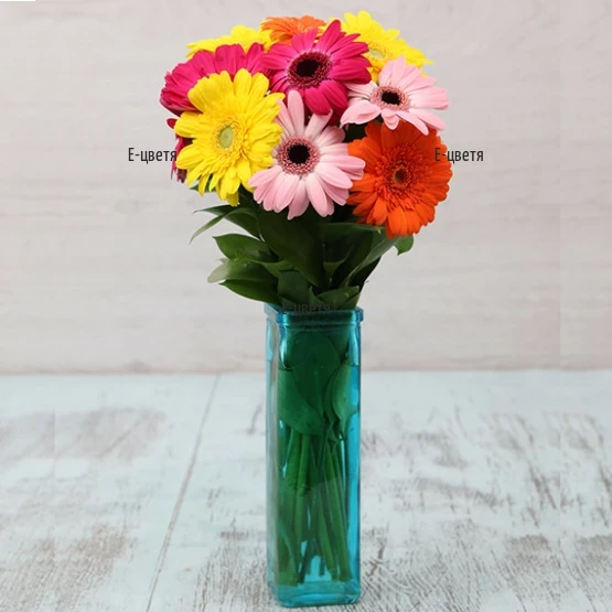 Online order and flower delivery - a bouquet of gerberas in a glass vase