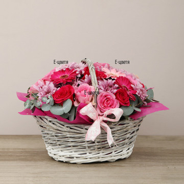 Tender, glamorous basket with flowers in pink hues - variety of flowers and colours.