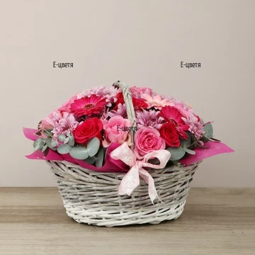 Tender, glamorous basket with flowers in pink hues - variety of flowers and colours.
