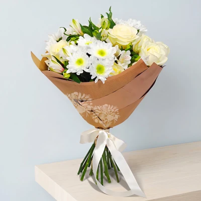 The white flowers are symbols of purity, magic and tenderness. Impressive bouquet of white flowers - roses, chrysanthemums and alstroemerias.