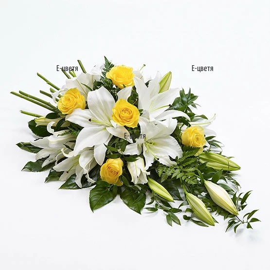 Send funeral arrangement of flowers by courier.