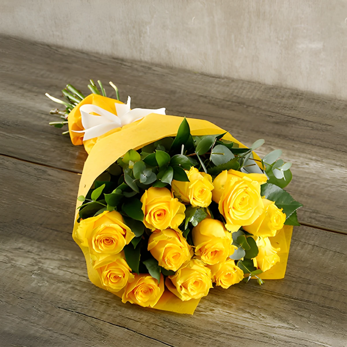 Send bouquet of yellow roses and greenery