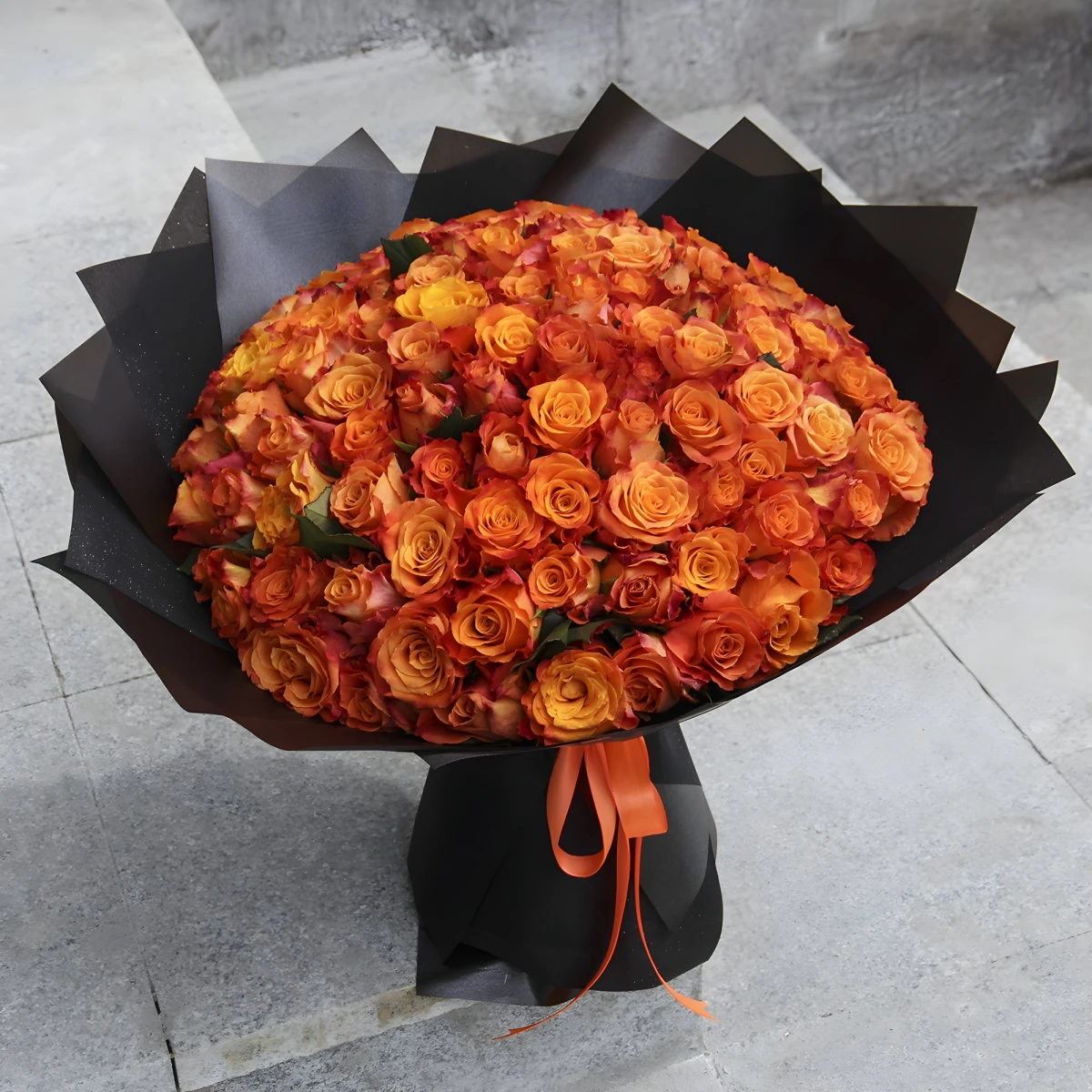 Send a bouquet of 101 orange roses by courier
