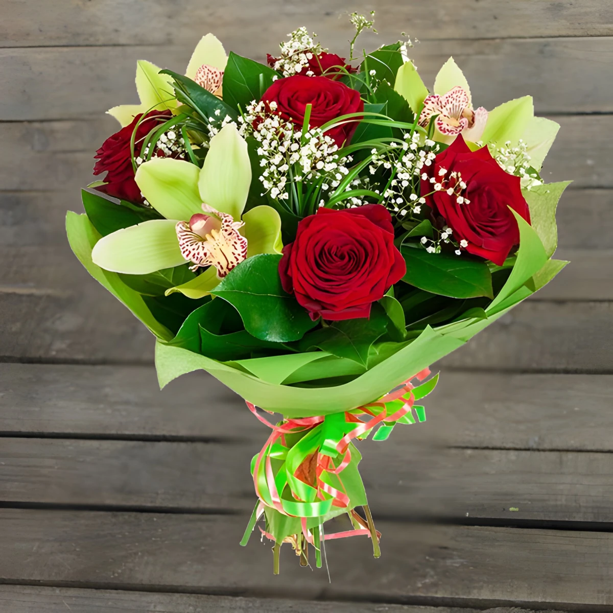 An online order and flower delivery - a bouquet of roses and orchids.