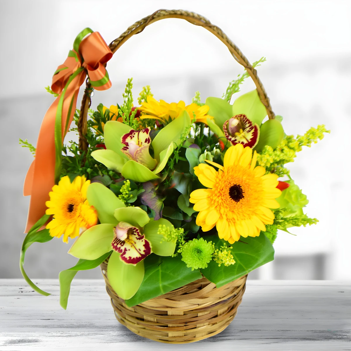 Send a basket with flowers - orchids and gerberas