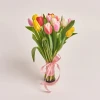 A bouquet of multicoloured tulips, tied wit a ribbon.