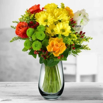Vibrant, colourful sensation of flowers and fresh greens - lovely  bouquet, arranged wih flowers, in accordance with the season.