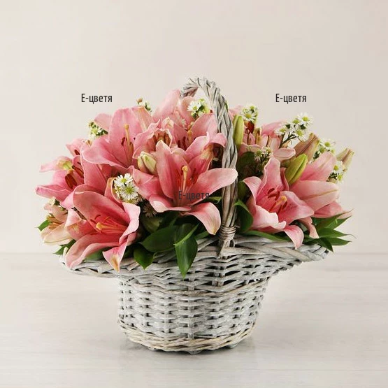 Send a basket with lilies and greenery.