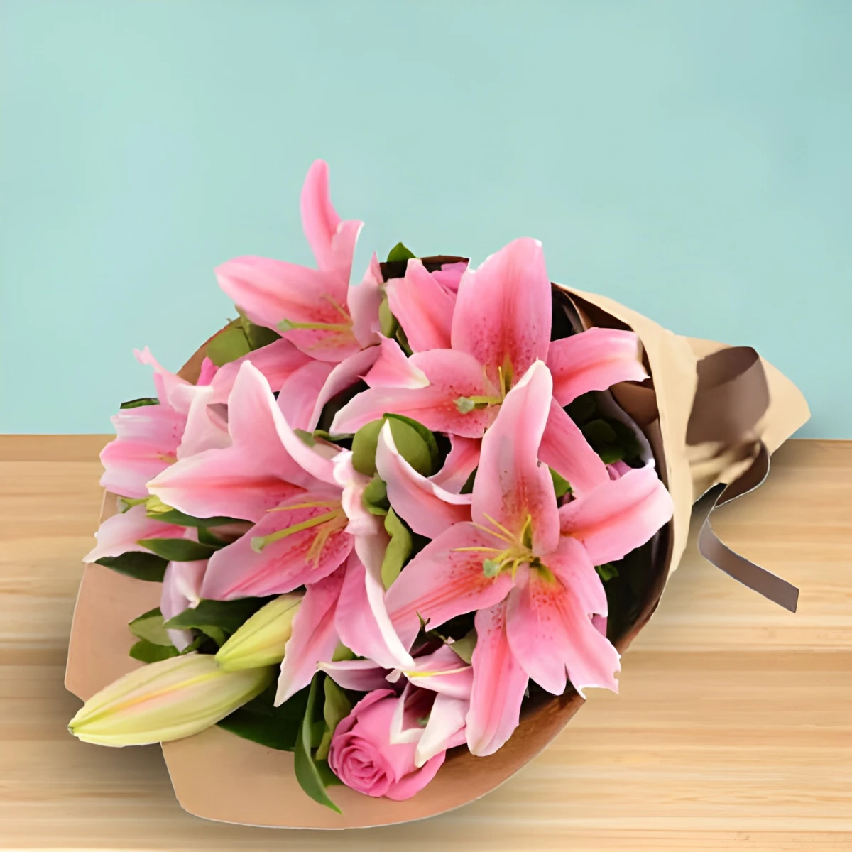 Delicate bouquet of pink lilies and roses