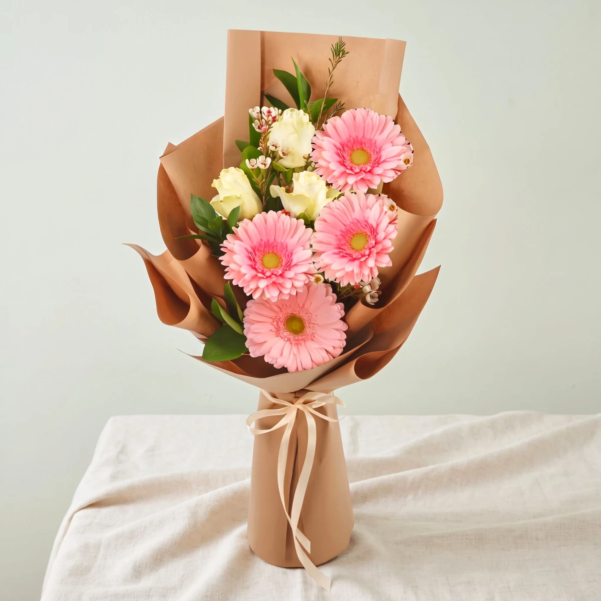 Order and delivery bouquet of pink gerberas and roses