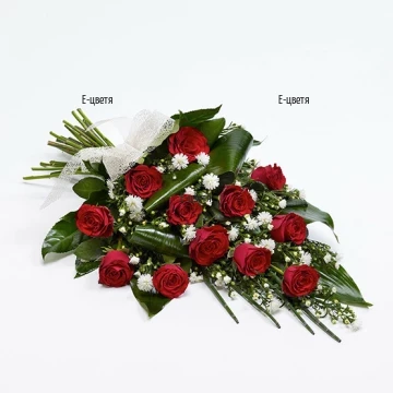 Enormous bouquet of red roses, lush foliage and chrysanthemums.